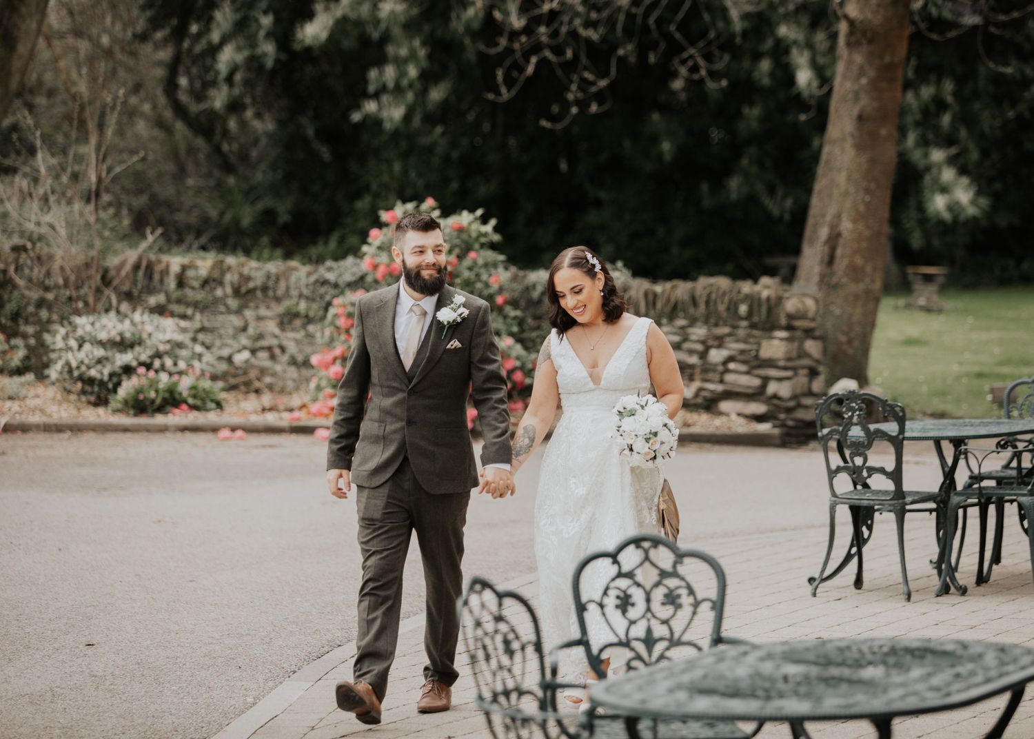 Bride and Groom walk outside at Devon wedding