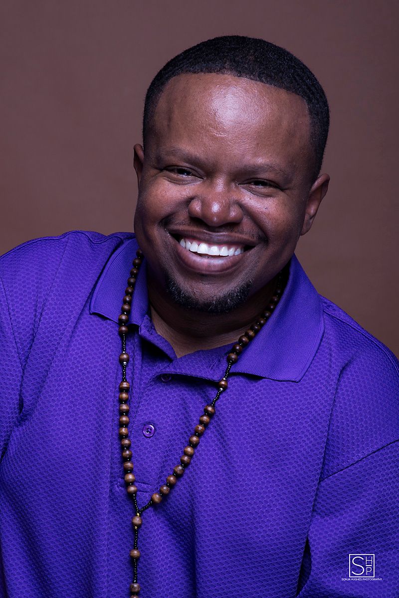 male smiles for portraits.