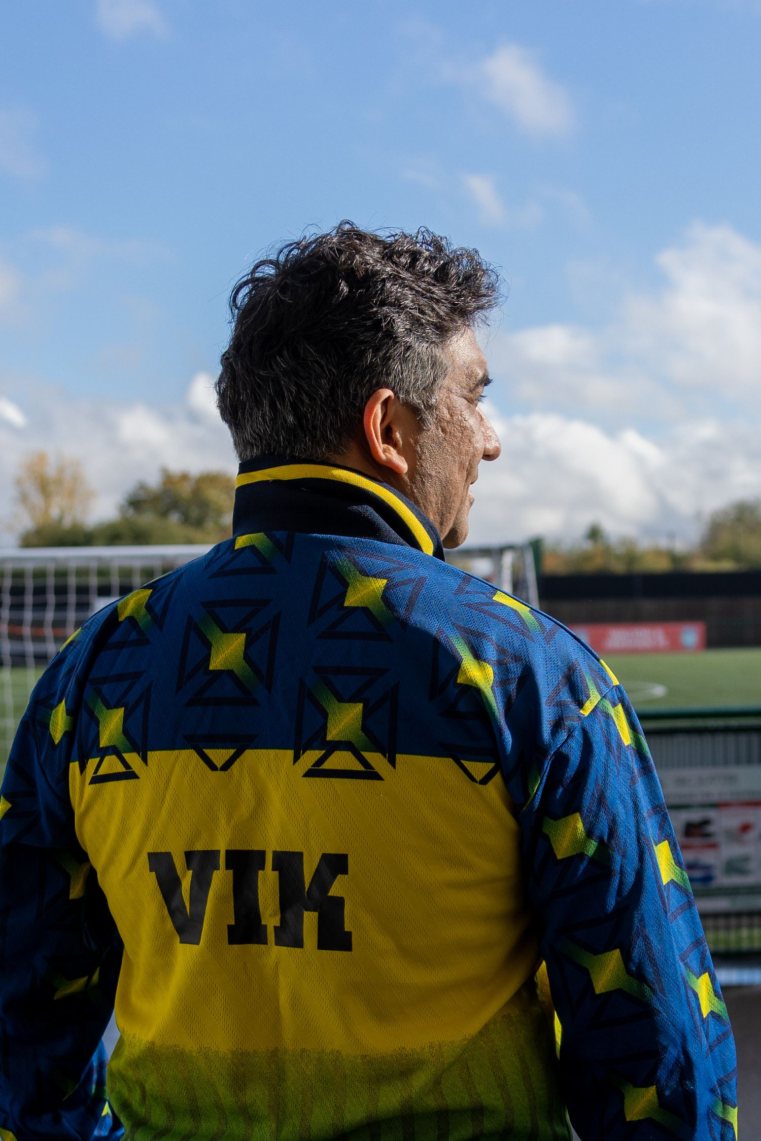 founder Indian man wearing a football shirt sunny weather