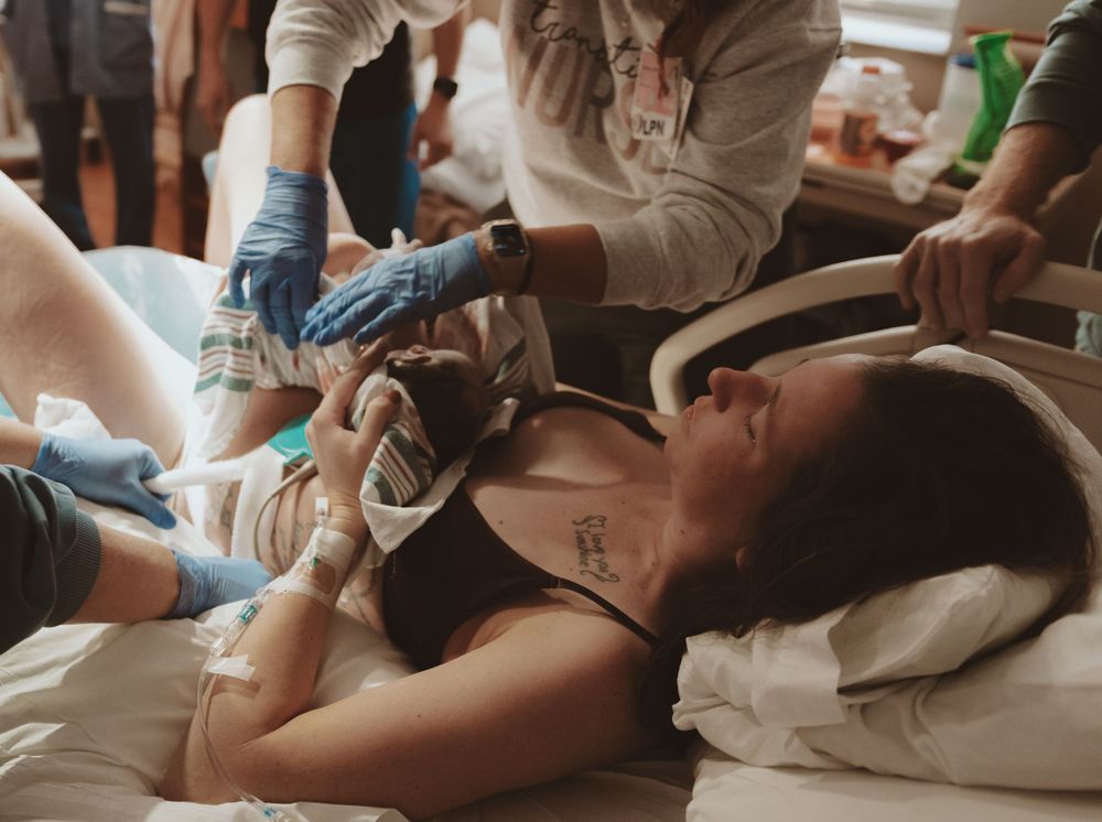 Medical professionals providing care to patient during intense moment.