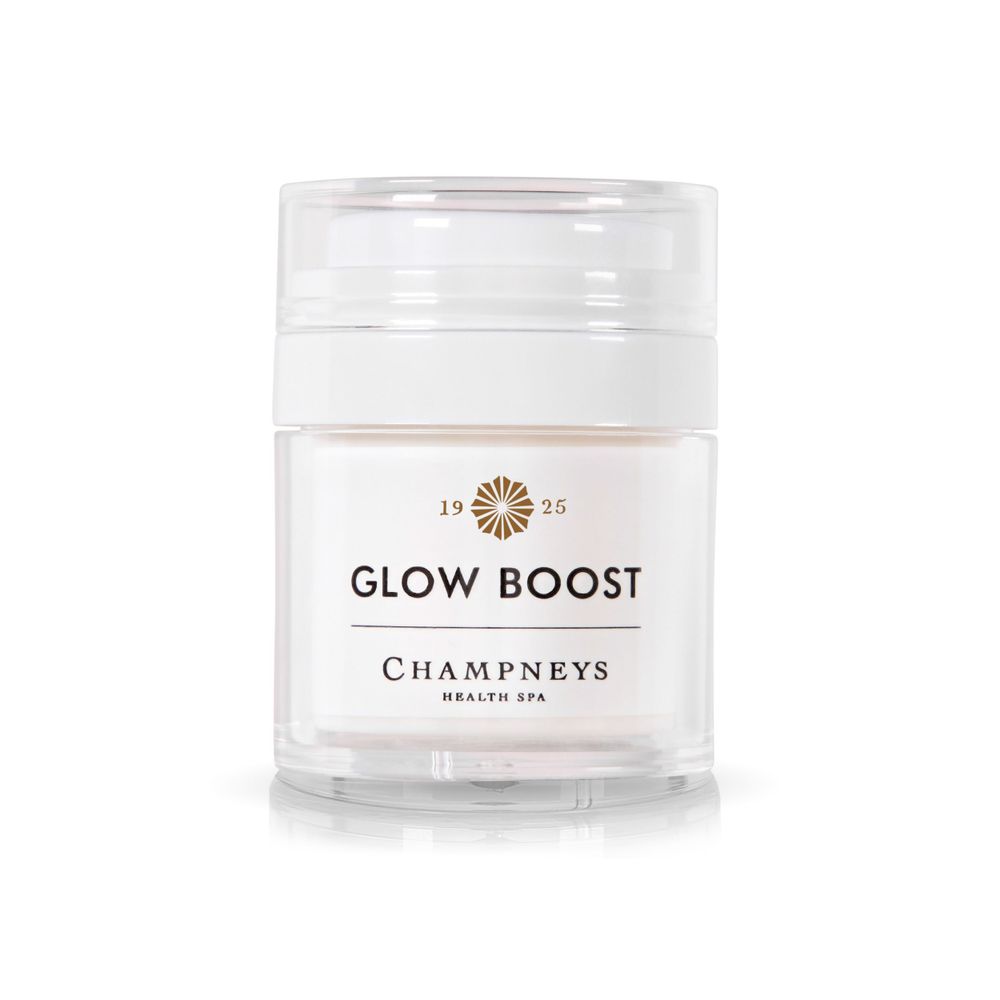 White jar of Champneys Glow Boost skincare cream with gold logo.