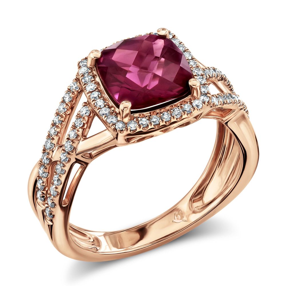Rose gold engagement ring with cushion-cut pink gemstone and diamond halo setting.