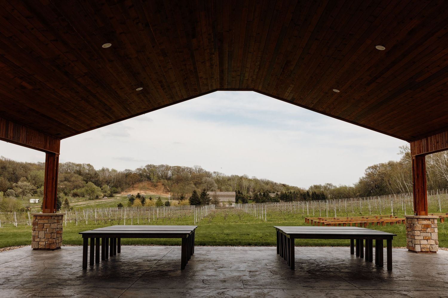 View from the pavilion to the ceremony site at Belle Ame Vineyard Wedding Venue in River Falls, Wisconsin