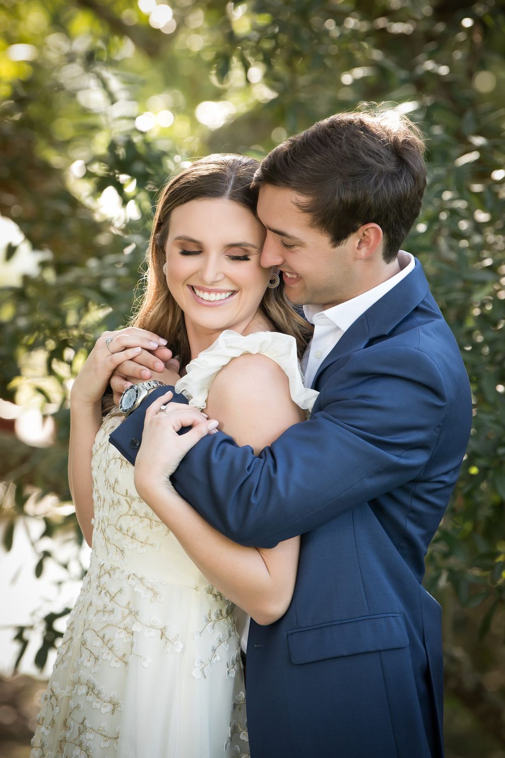 Tender moments between newlyweds captured in a garden with beautiful bokeh lighting effects.