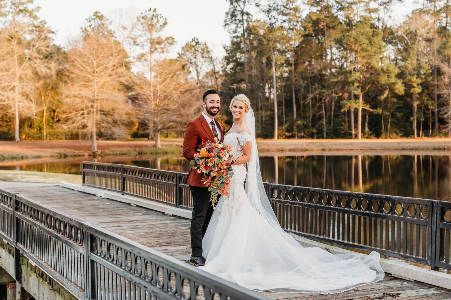Bride and groom on the bridge at The Woodlands Country Club after their wedding vows.