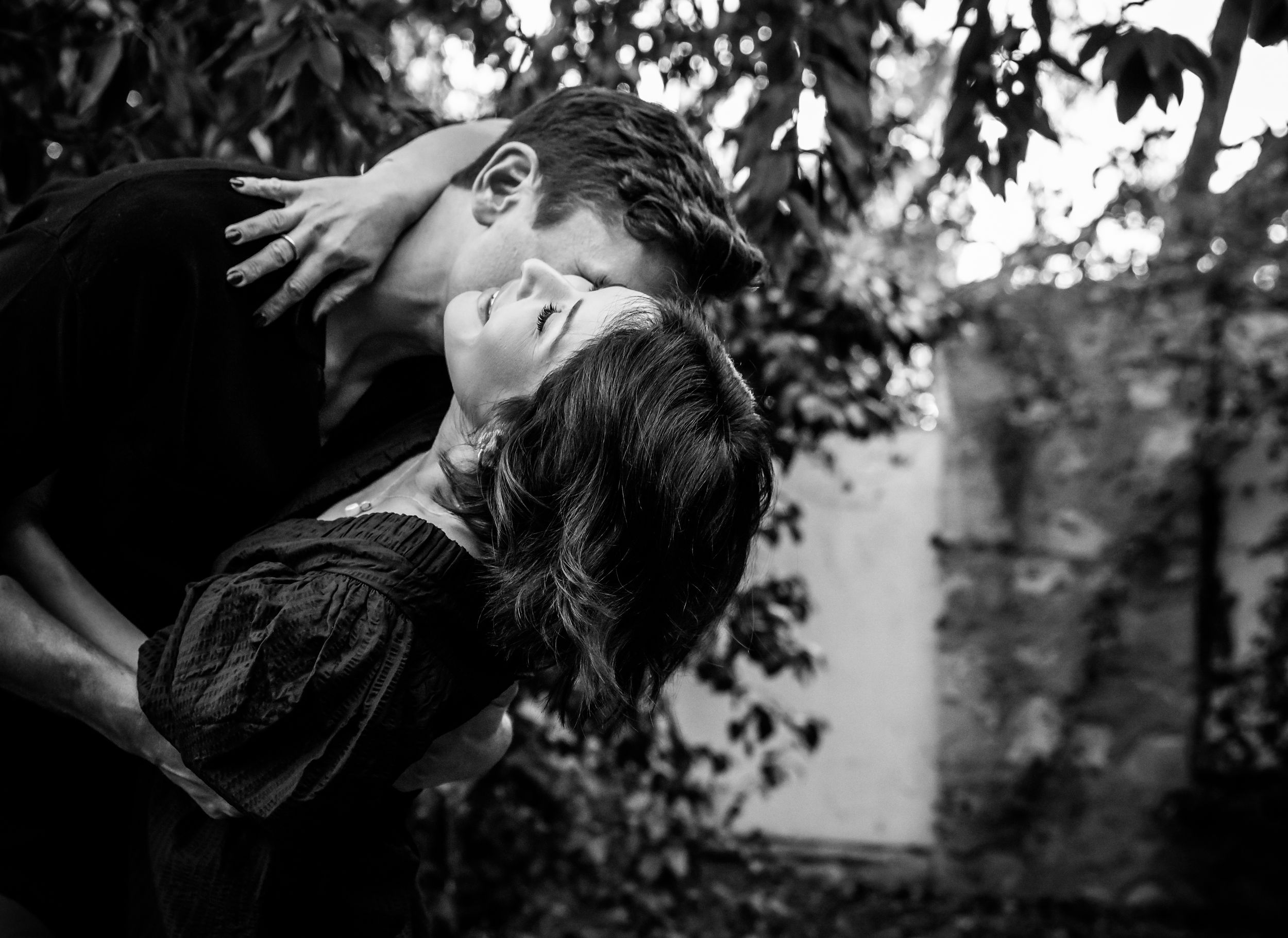 Artistic black and white portrait of an intimate romantic moment.