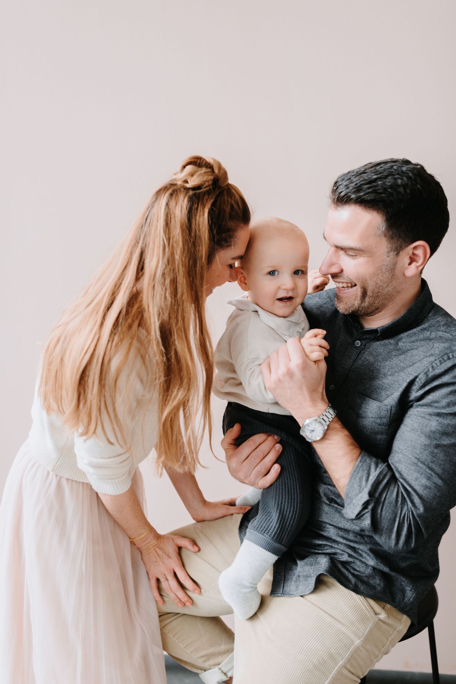 Candid family moment showing tender interaction and joyful expressions.