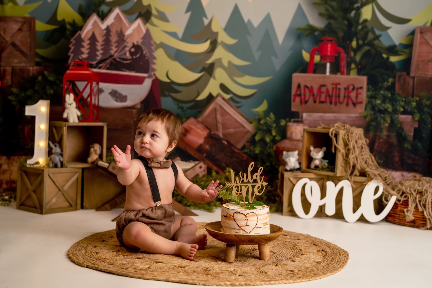 Wild One 1st birthday cake smash session in a Bothell studio. Fun, authentic birthday photography by Filling the Frame Photography