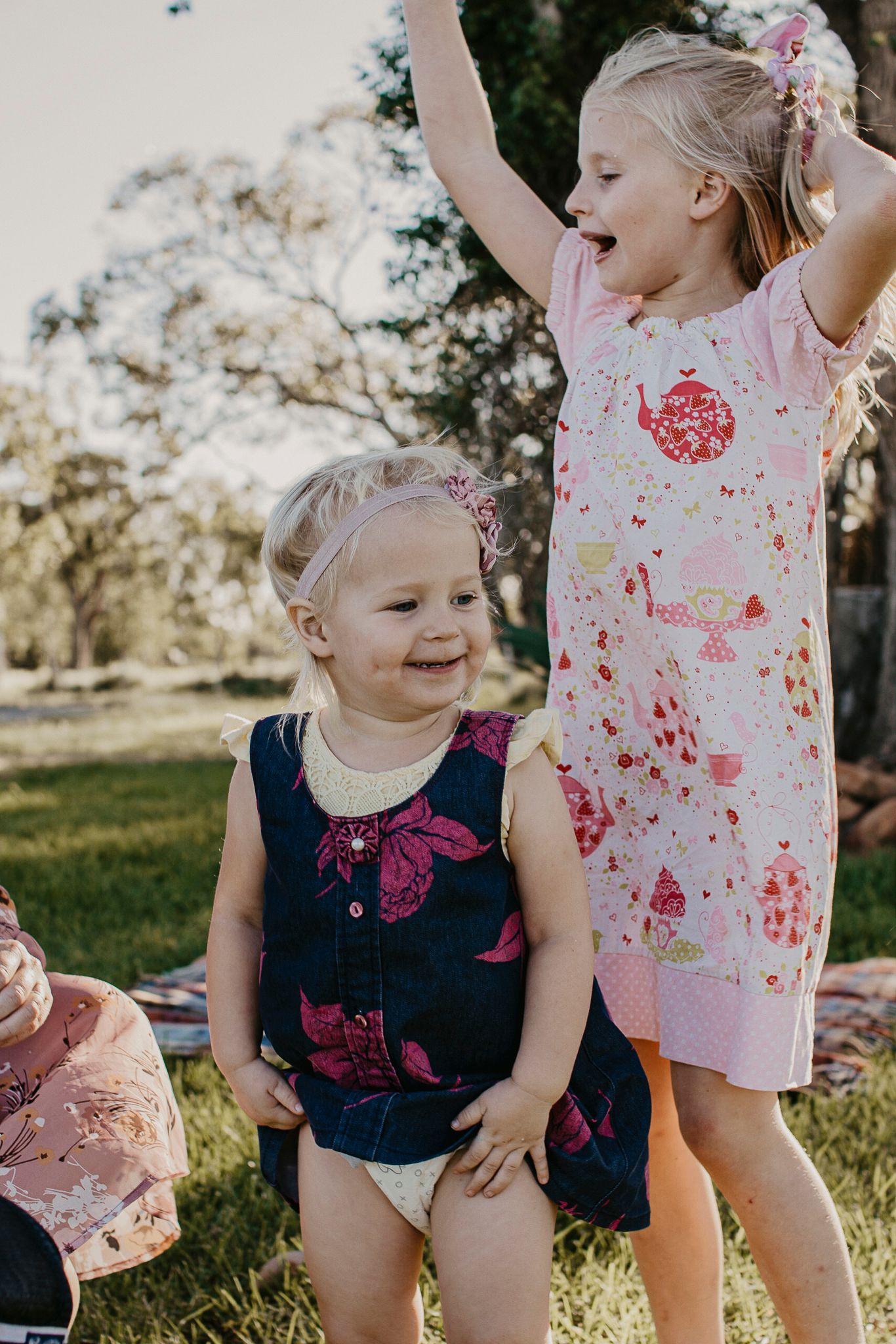 Siblings in a rural landscape having fun.