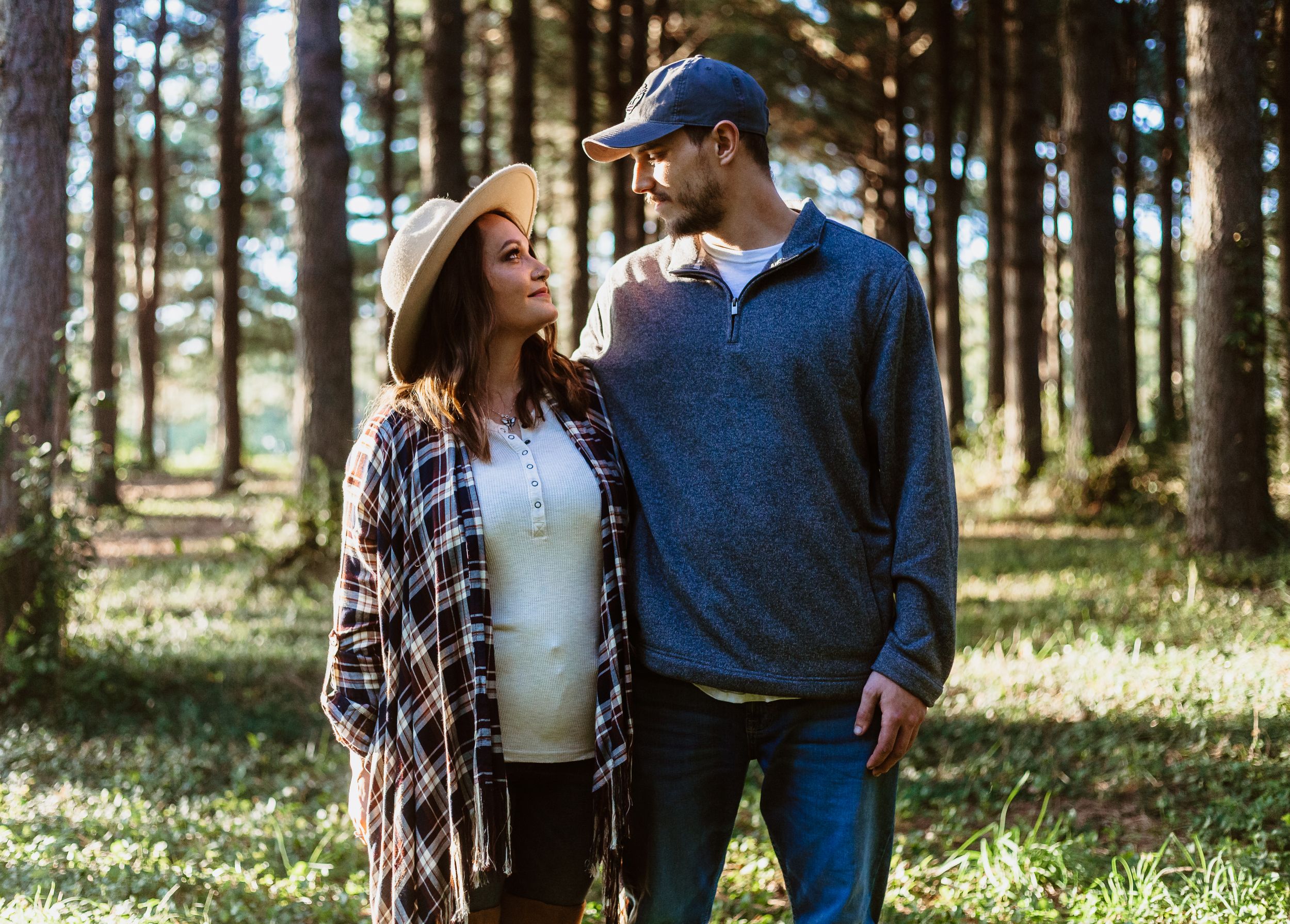 couple pose in woods