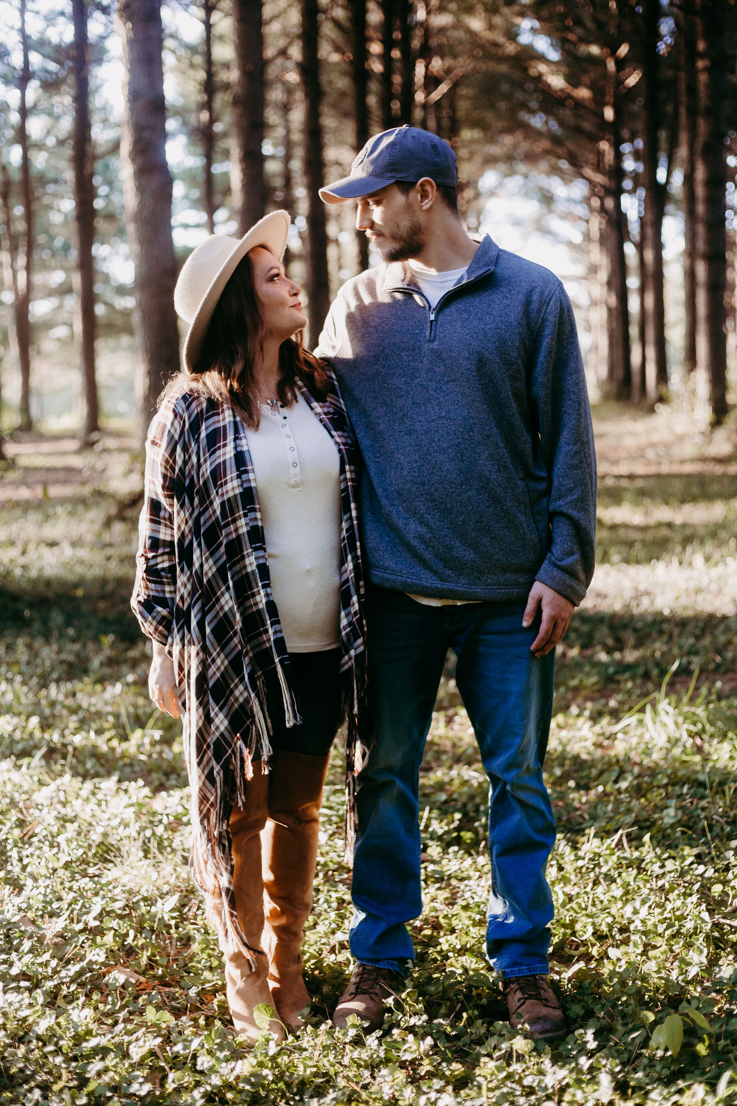 couple pose in woods