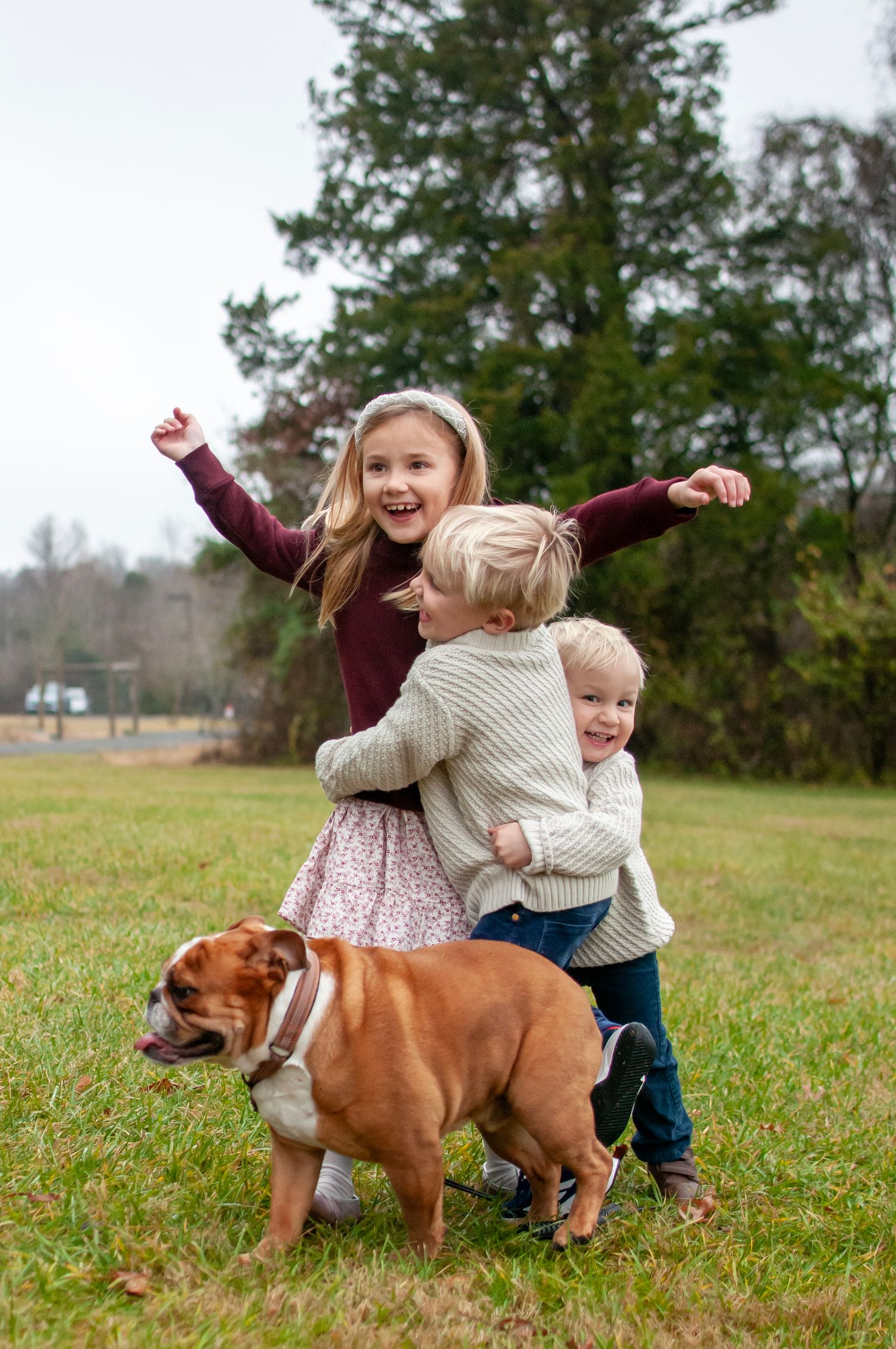 Three kids and a dog at Claude Moore Park candid photo