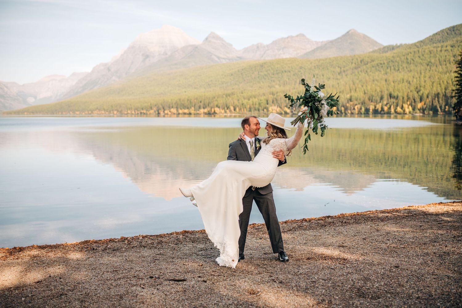 couple getting married at bowman Lake in glacier national park