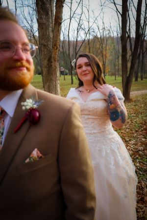 A couple shares an intimate moment during their autumn wedding photoshoot.