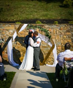 A sequence of wedding dance moves captured on an outdoor stone patio.