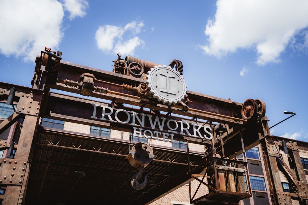 Vintage Ironworks building exterior with rustic metal signage against blue sky.