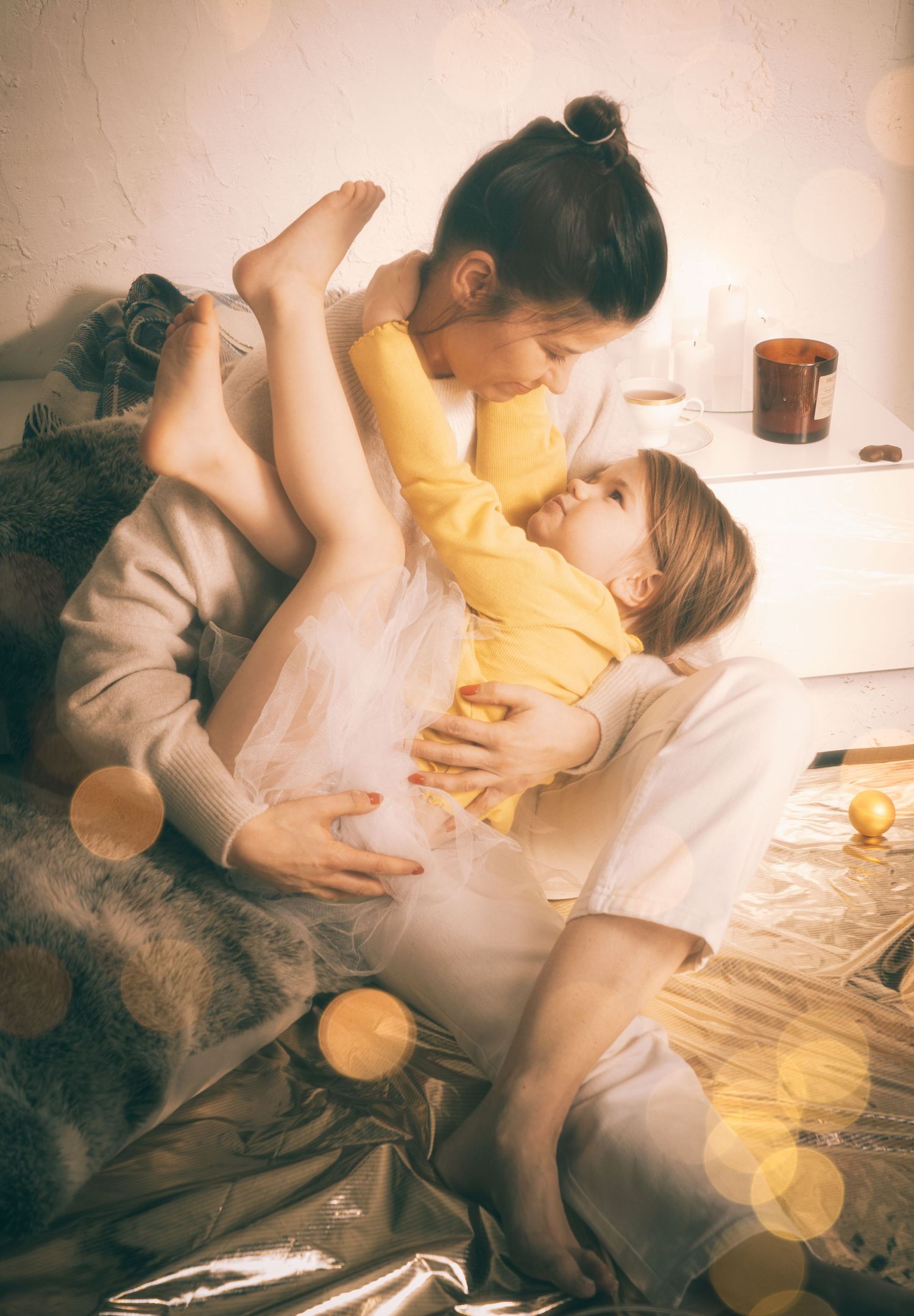 Intimate lifestyle portrait with soft lighting and bokeh effects.