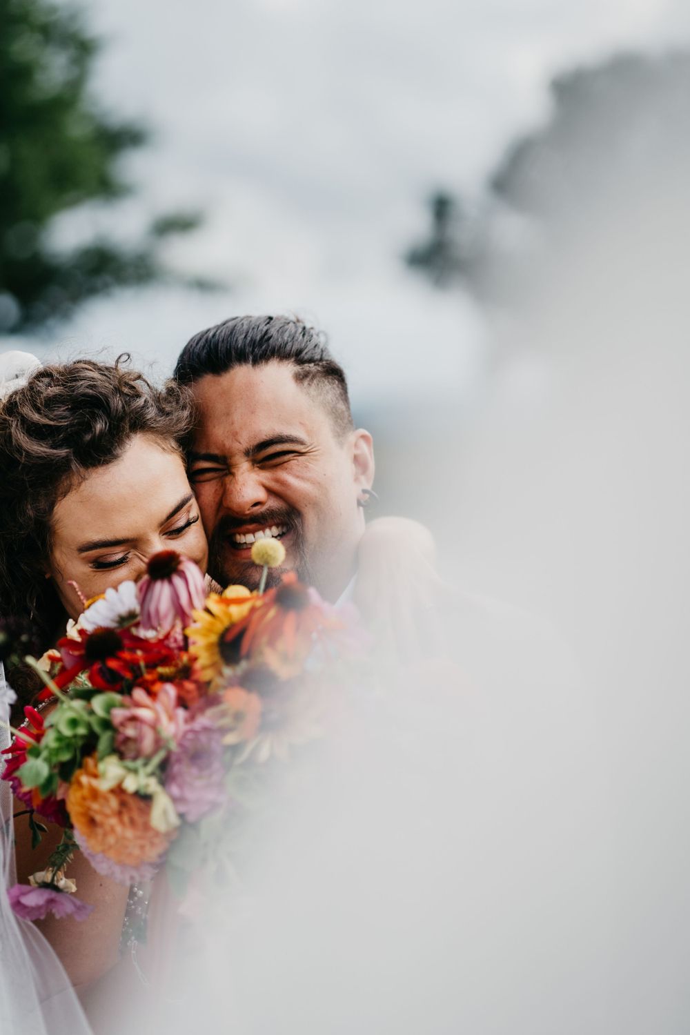 bride with colourful bouquet