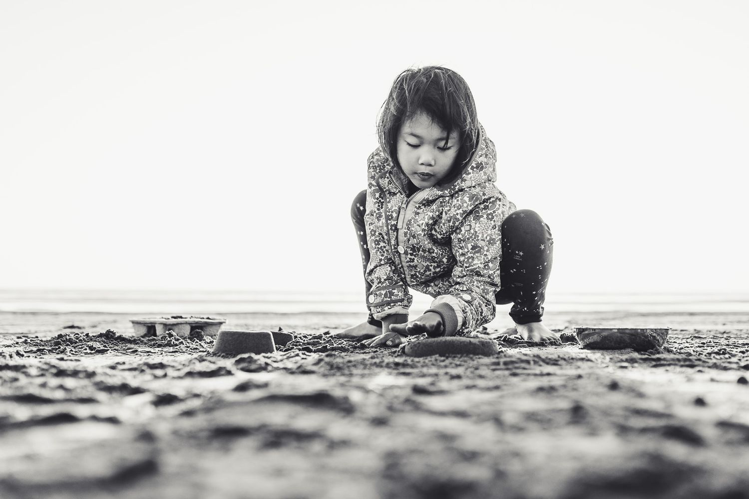 Ellie is making sand castles in Oregon Coast