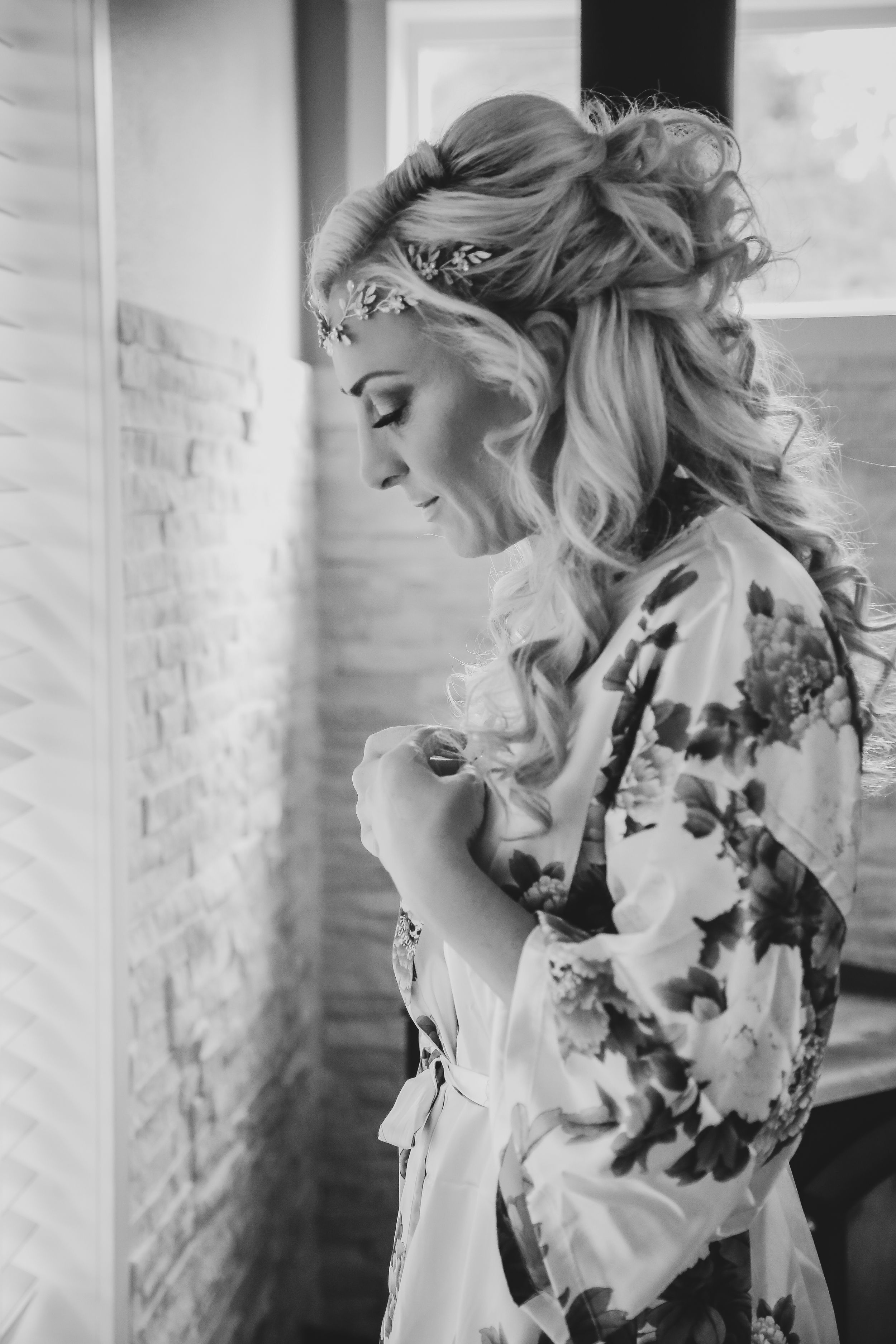 Elegant bridal portrait with white flowers and soft lighting.