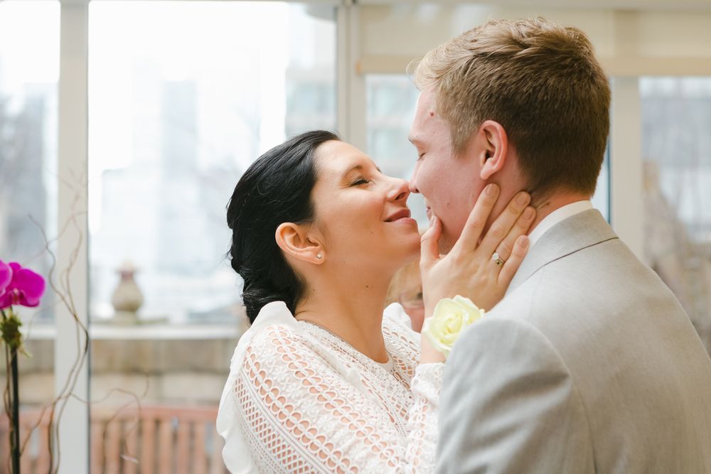 a candid moment of a clouple embracing each other during their wedding at the Library Hotel in NY during their elopement