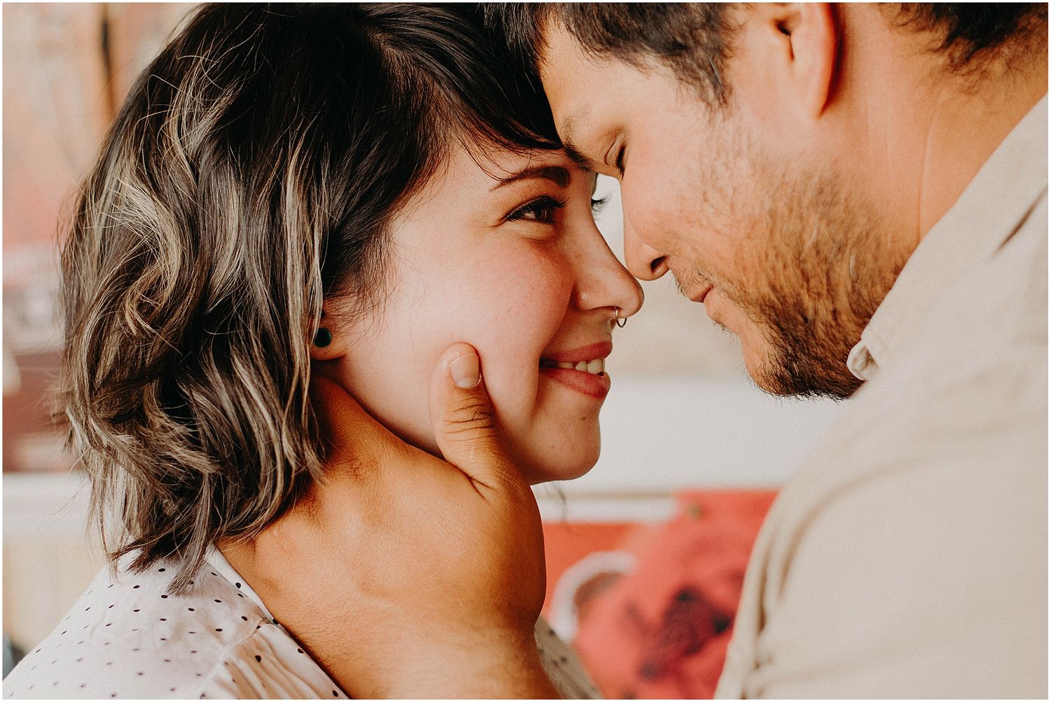 An intimate close-up of two people sharing a moment in a record store setting.