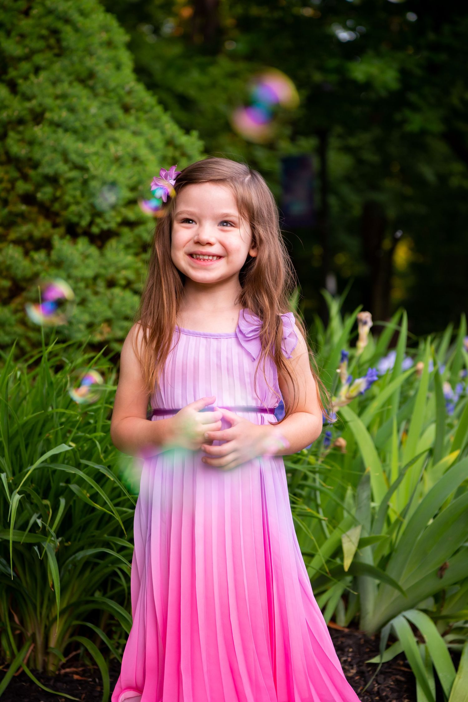 girl in pink dress with bubbles