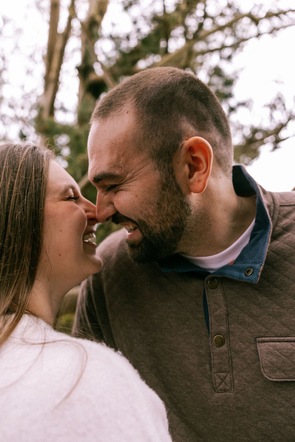 A couple shares intimate moments in a series of close-up photos showing them kissing and embracing outdoors.