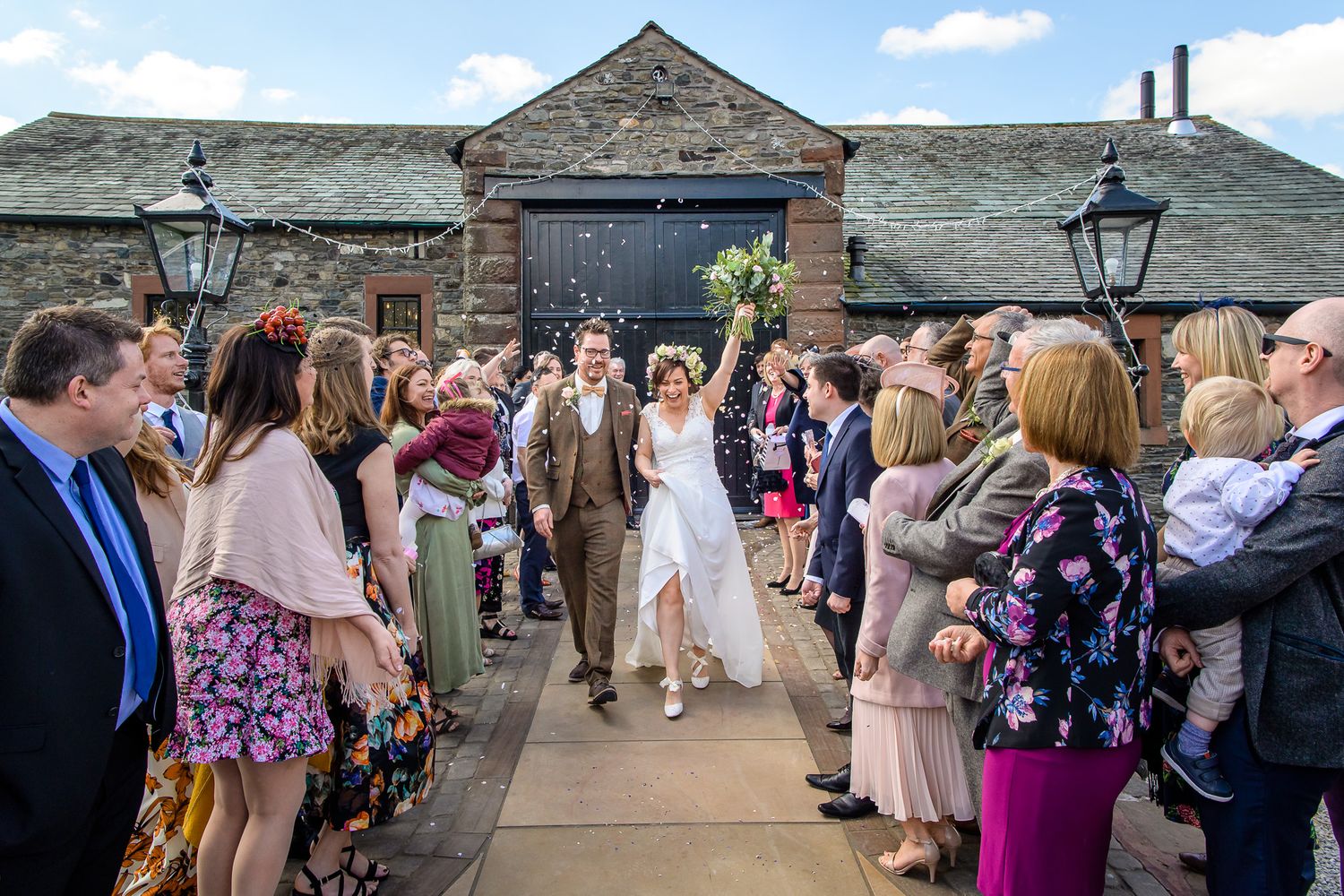 Bride and groom showered with confetti at New House Farm wedding