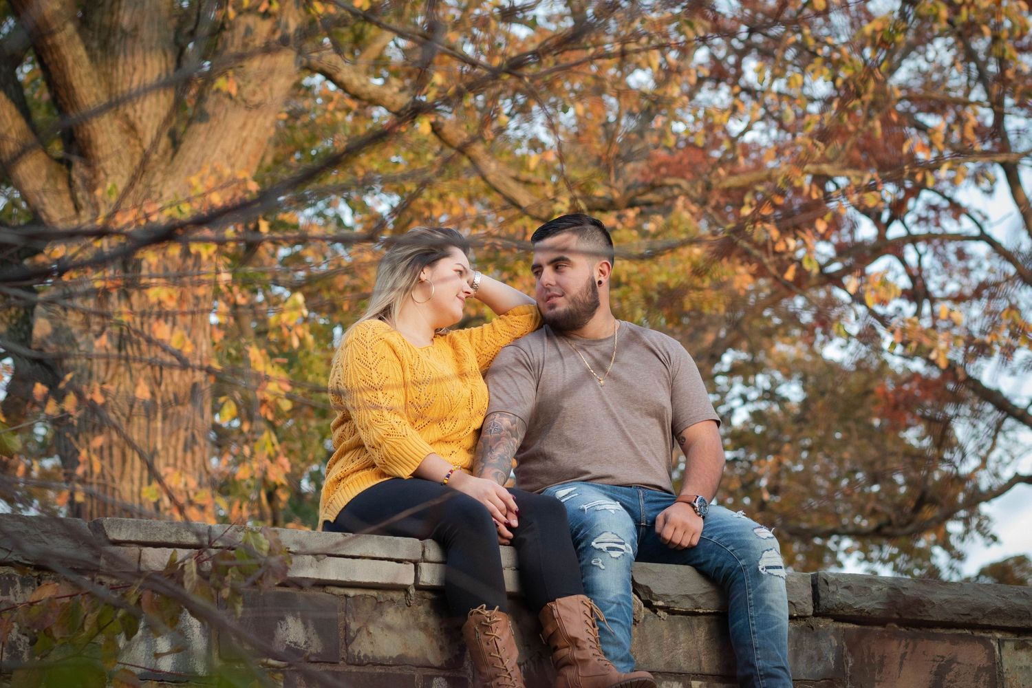couple looking at each other on a bridge in New Jersey called Warinanco park