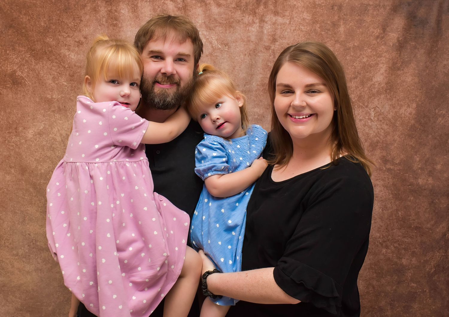 A collage of five portraits of a family dressed in casual clothing against a brown textured backdrop.