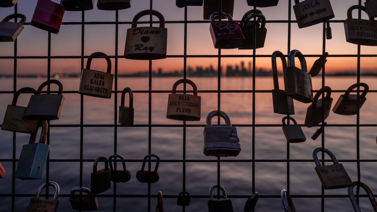 Love locks on fence at waterfront sunset, romantic location photography, Thr Shipyards North Vancouver