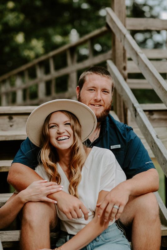 Smiling married couple shares a laugh during a couple photoshoot with Anna Holman Photography.