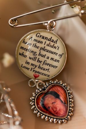 Sentimental wedding keepsake charm with engraved message and decorative frame.