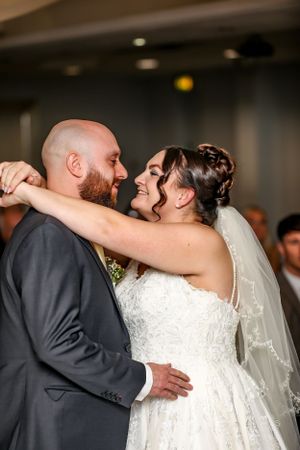 Sweet moment of newlyweds dancing at their wedding reception.
