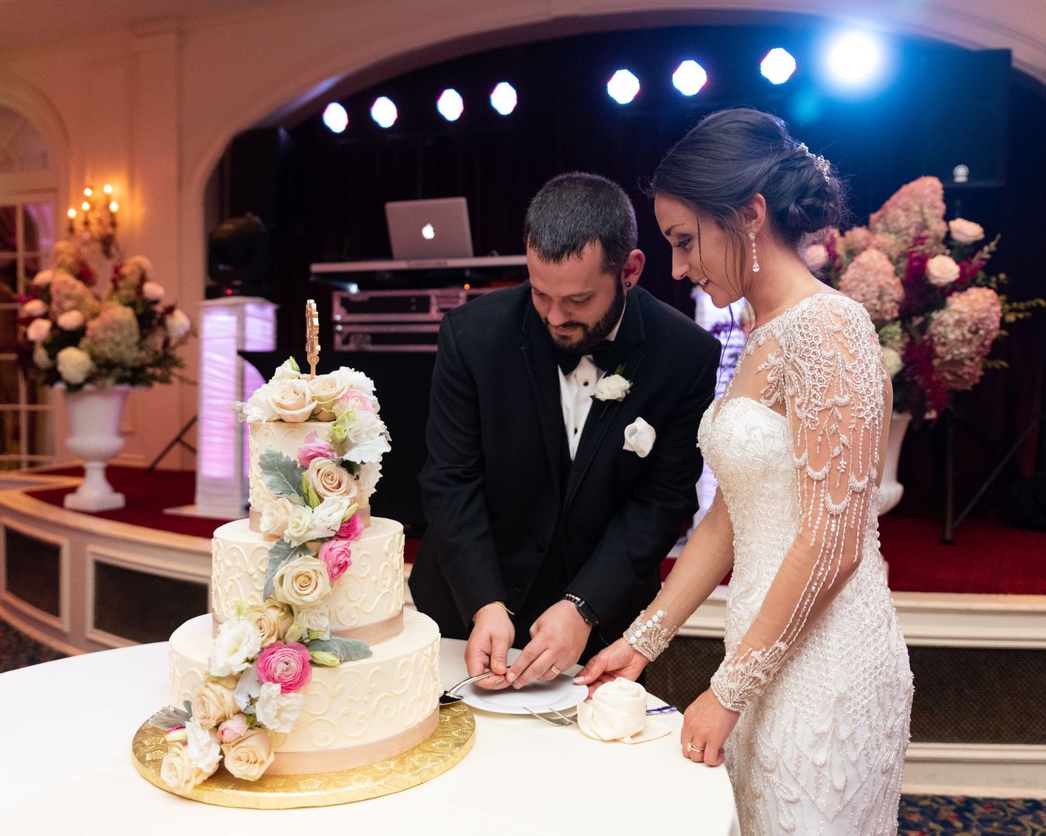 Bride Groom cut wedding cake at Wentworth by the Sea Marriott hotel Portsmouth NH Leah Ramuglia Photography