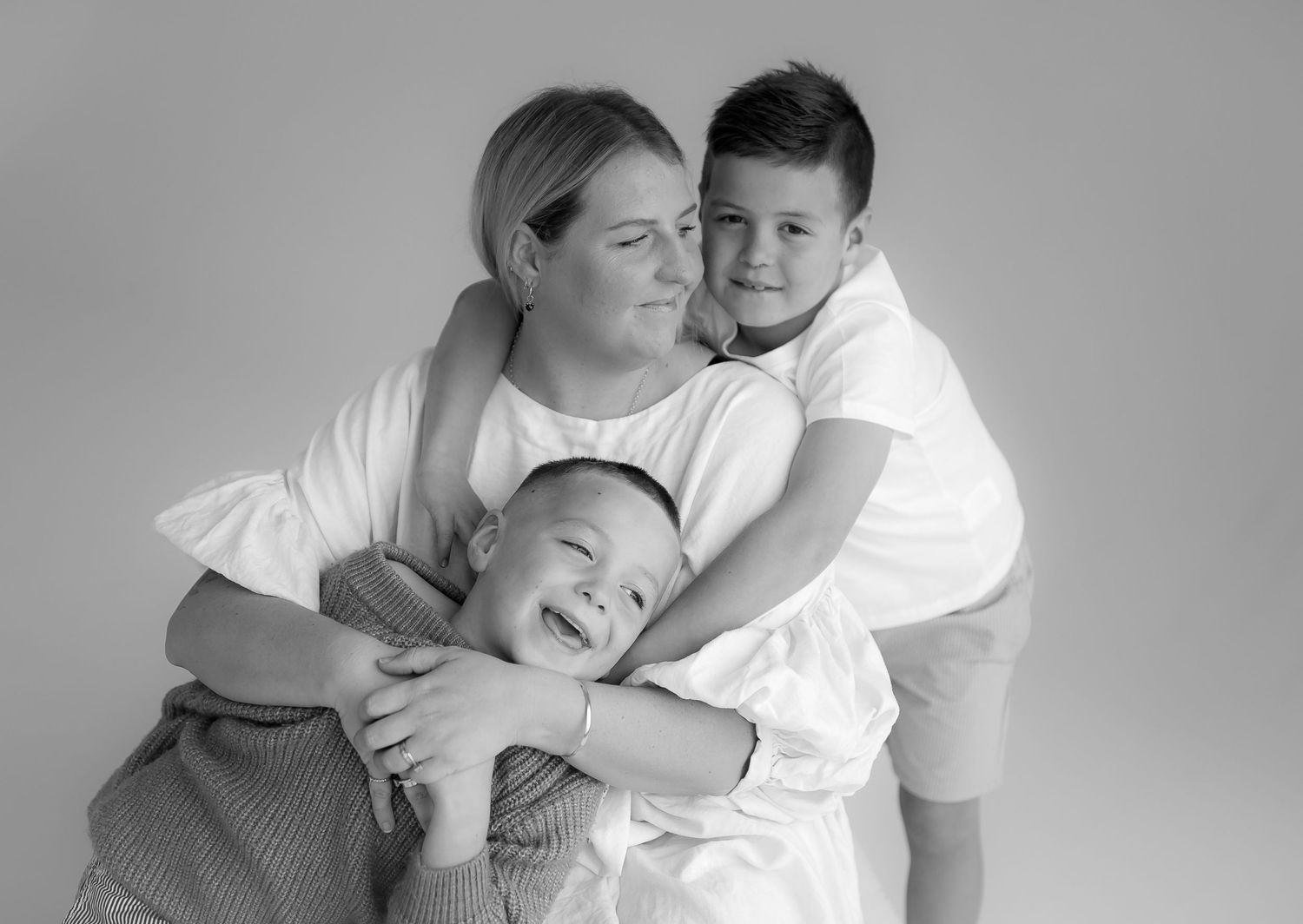 Black and white portrait series showing tender moments between couple.