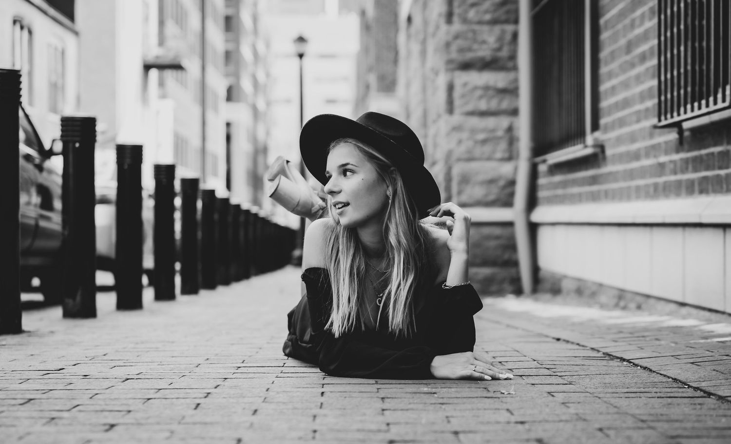 Black and white artistic street photography with urban architecture and moody lighting.