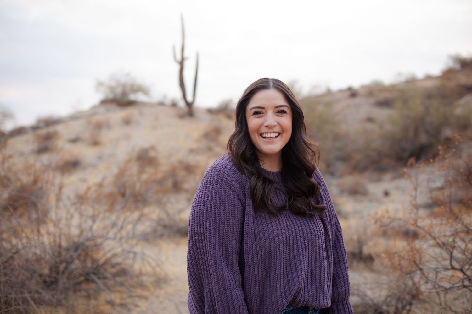 Portrait of girl in the desert, smiling in Phoenix, Arizona with cactus