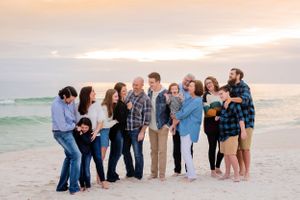 fun extended family portrait session at sunset on Panama City Beach Florida