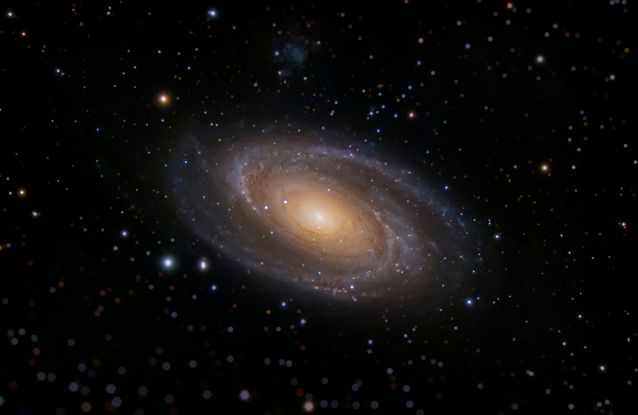 An elegant spiral galaxy displays its symmetrical structure against the backdrop of distant stars.