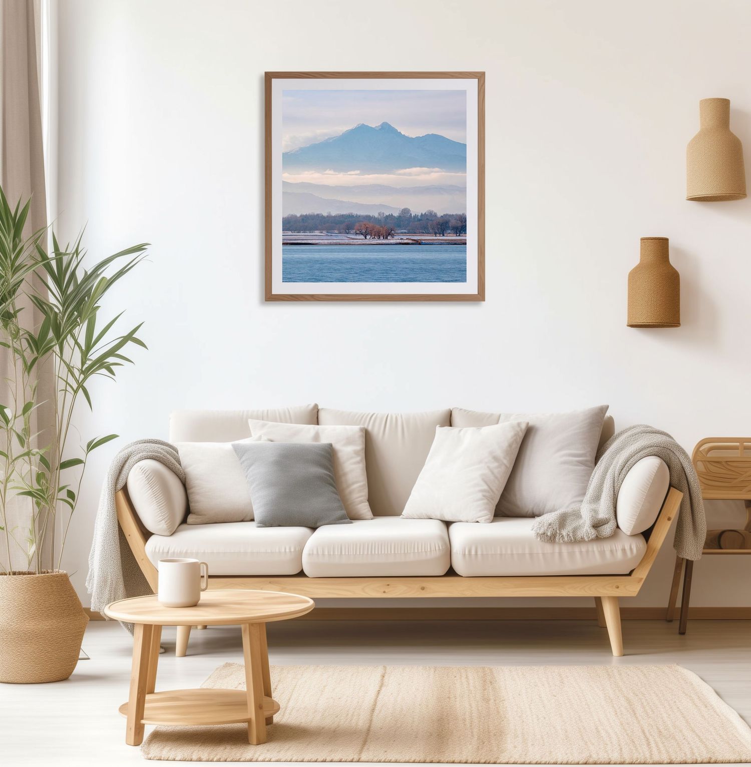 A framed fine art print of Longs Peak by Jonathan Sprigler in a modern living room