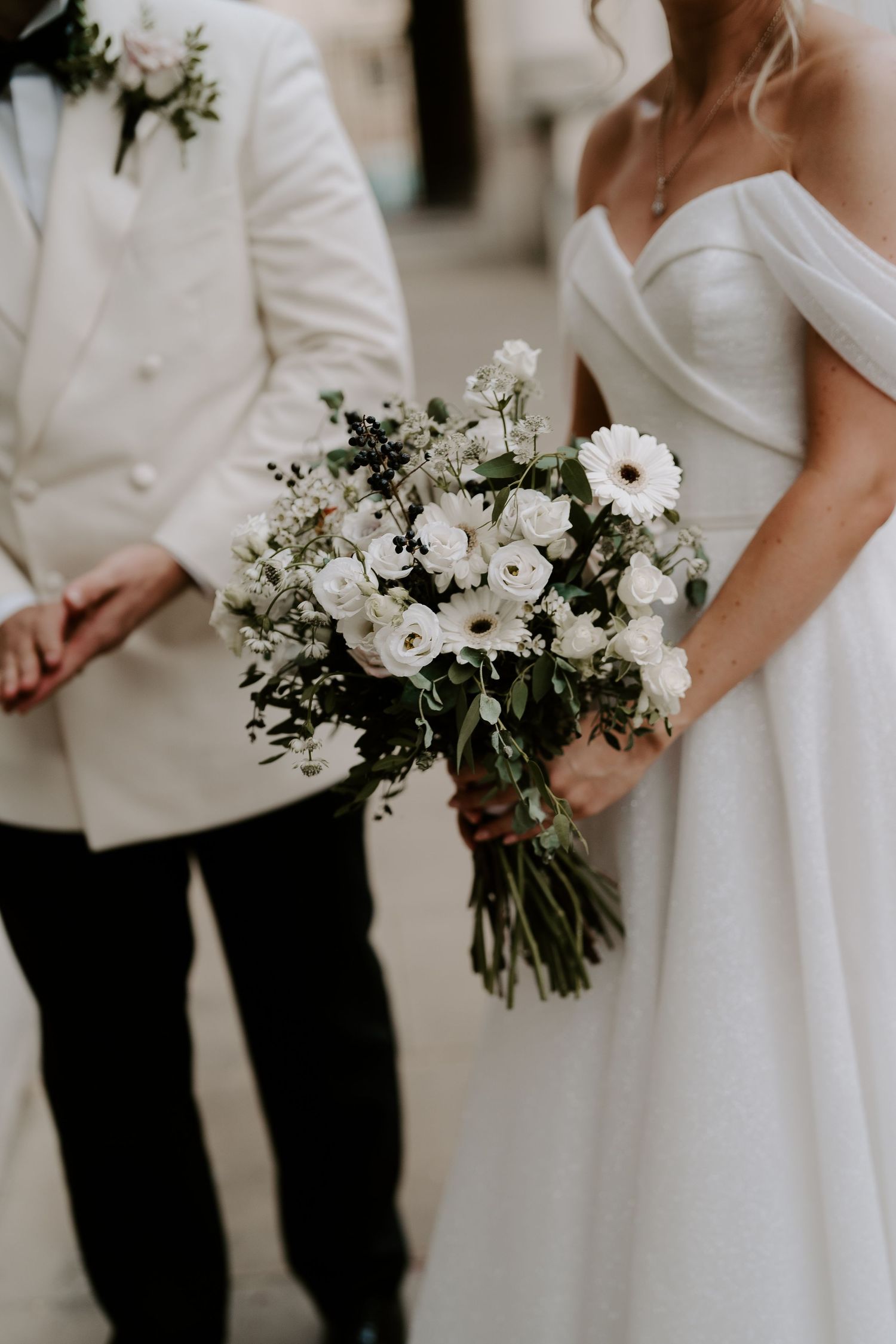 close up of bride holding bouquet outside the Ashmolean Museum in oxford