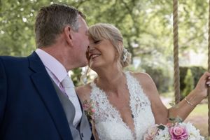 A couple sharing an intimate moment during their wedding celebration.