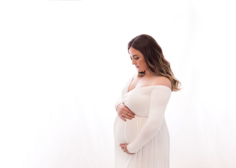 pregnant woman in white dress, maternity photographer sarasota baby photos, newborn photography wellen park fl