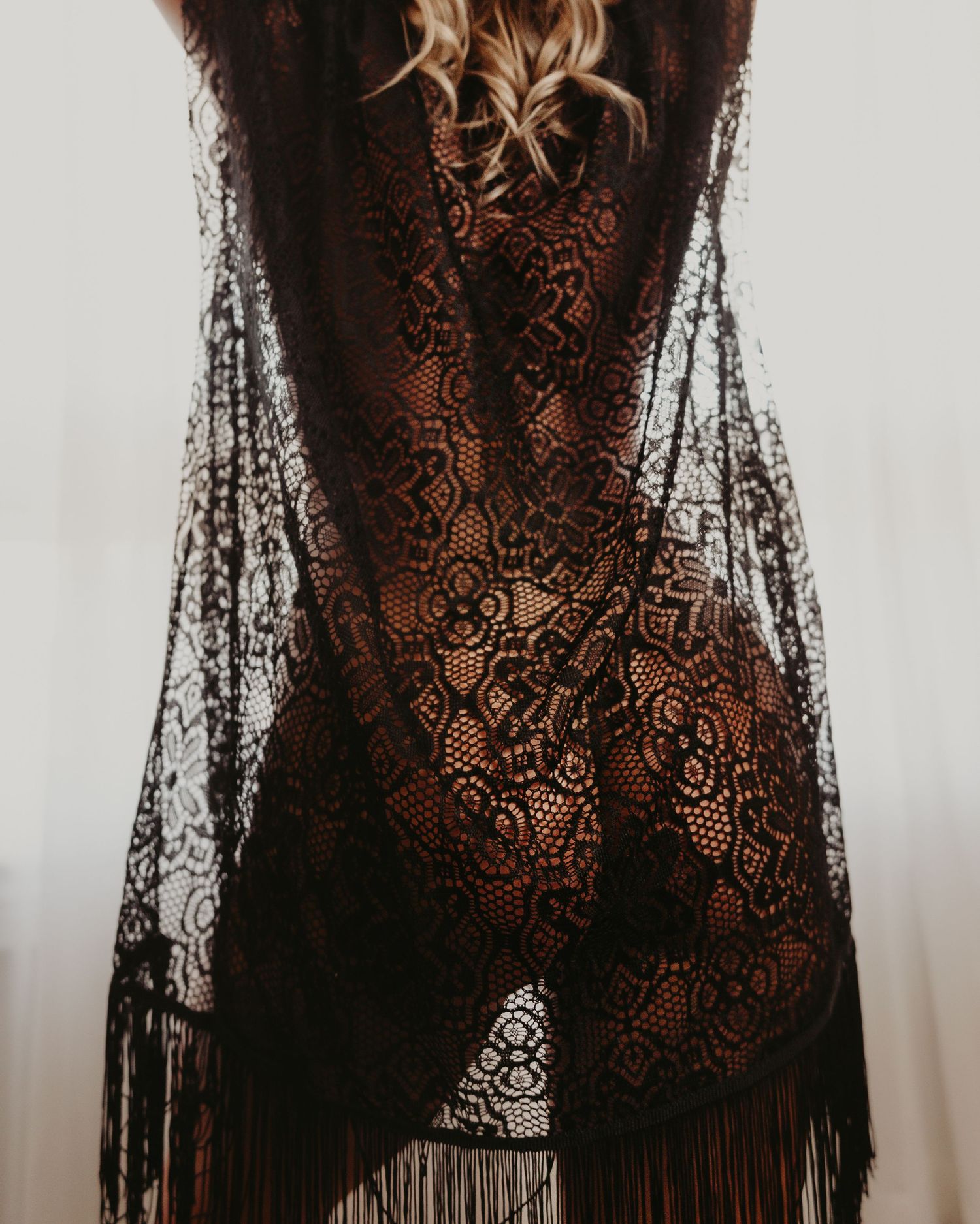 artistic intimates boudoir photo blonde woman silhouette in black lacey robe pose back only