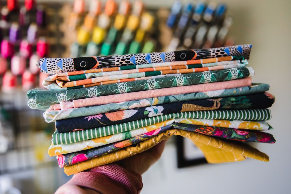 Stack of colorful patterned fabric bands and ribbons shown in close-up detail.