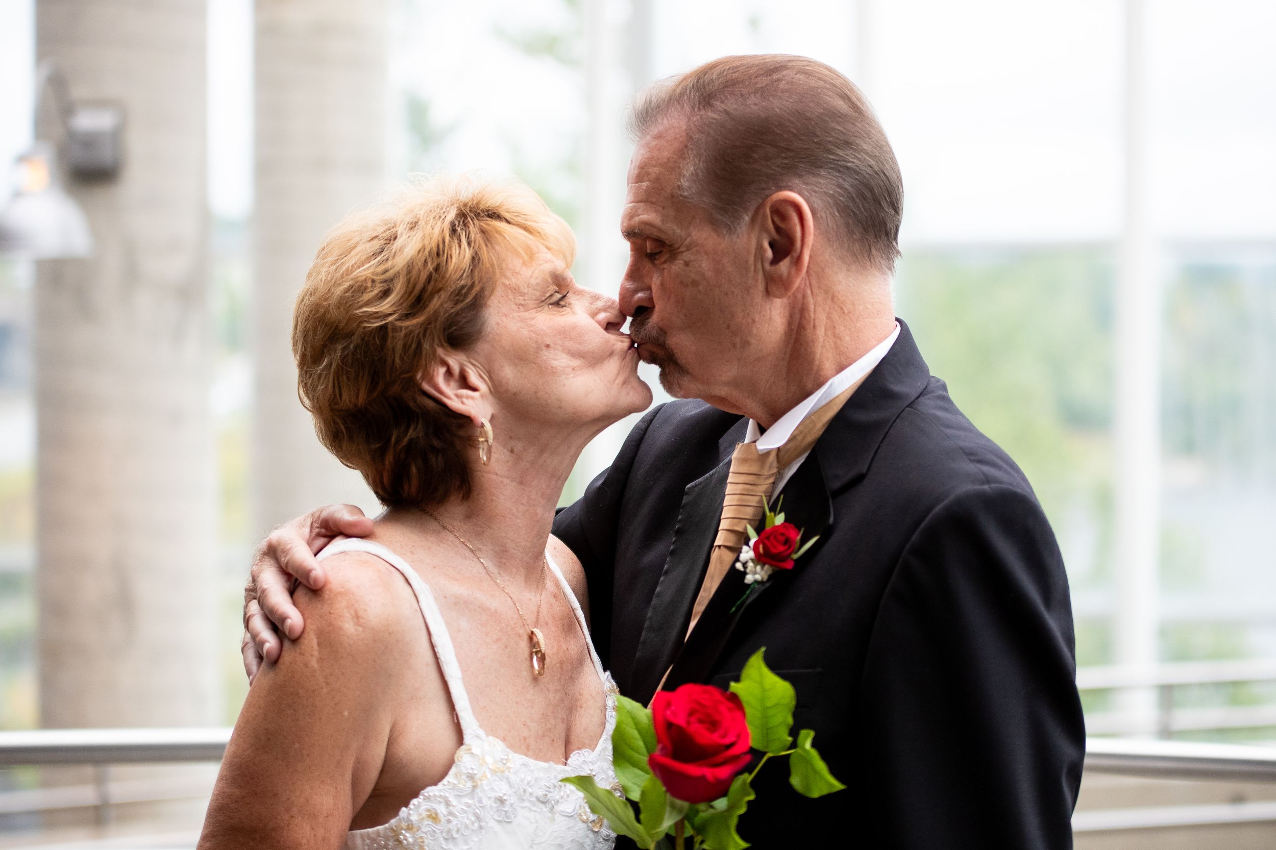 Romantic wedding photo collage showing intimate moments and kisses between newlyweds in formal attire.