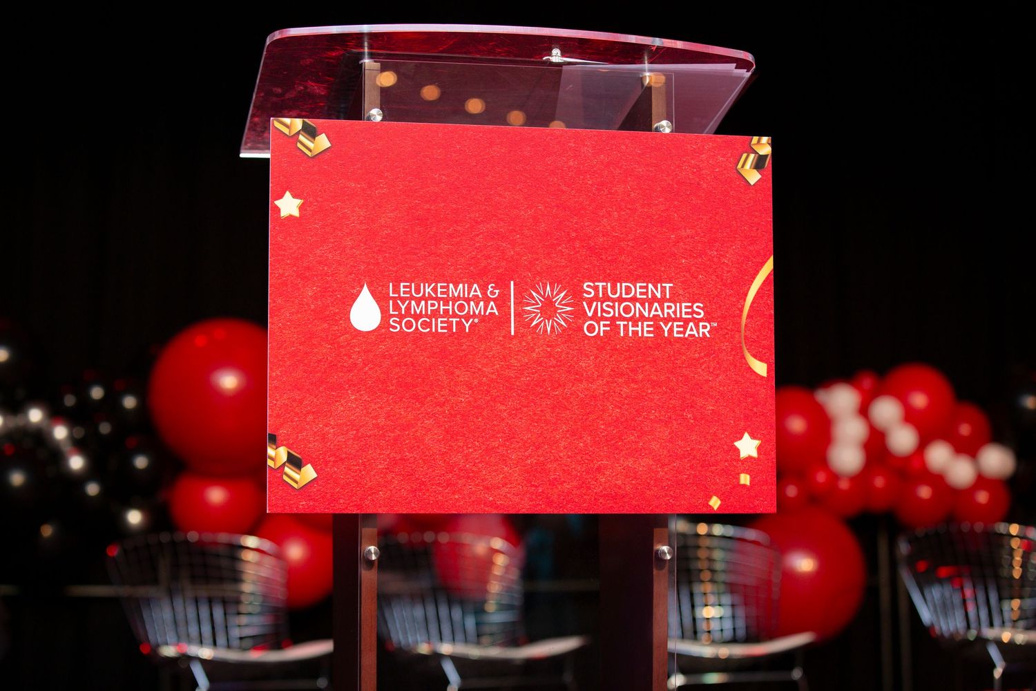 Red holiday greeting cards displayed against dark backgrounds with glowing lights and stars.