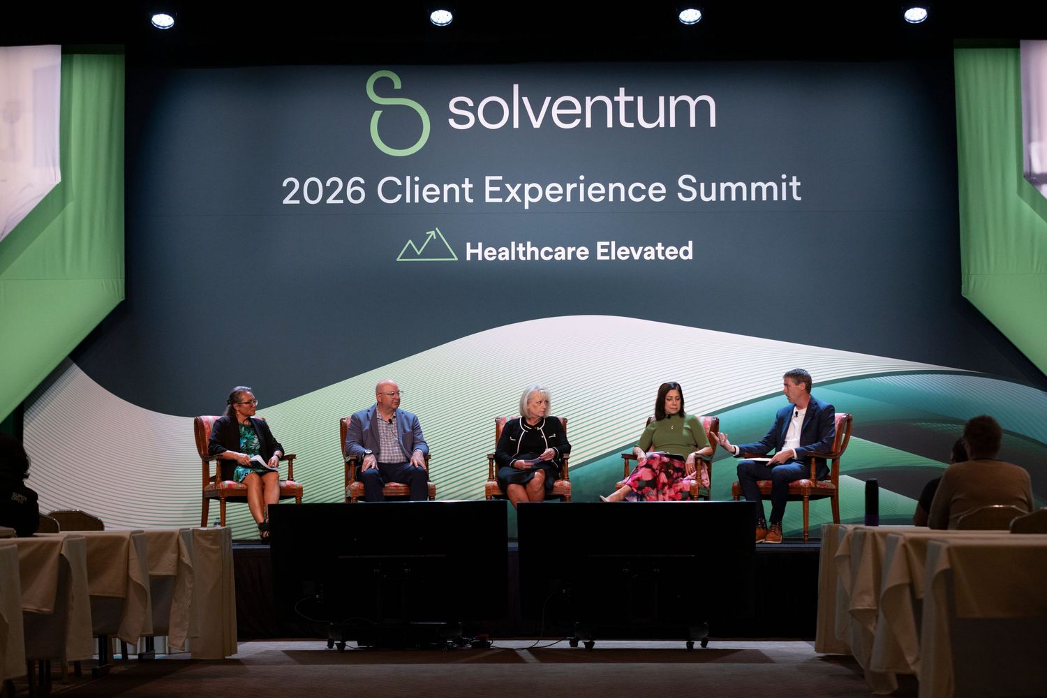 Five panelists on stage at Solventum 2026 Client Experience Summit Healthcare Elevated conference event.
